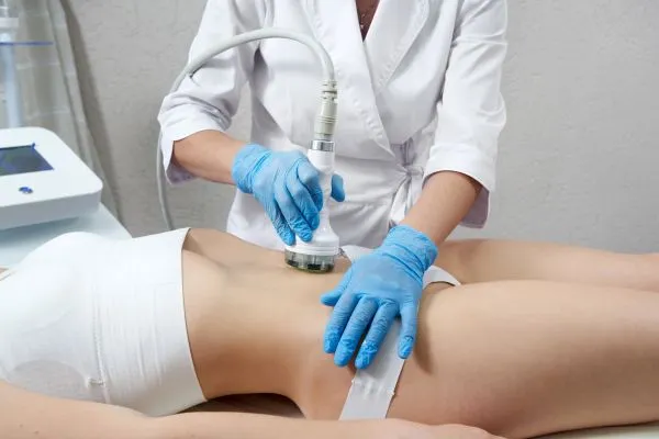 Lost the Weight but Not the Loose Skin? 2 woman having HIFU treatment on her stomach to combat loose skin Hemel Hempstead following weight loss